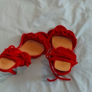 A red sandal heels in size us8